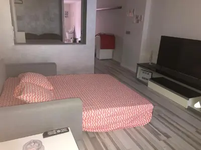 a bedroom with a bed and a flat screen tv at Villa Bruno&Playa de Valencia in Valencia