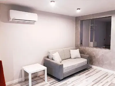 a living room with a couch and a table at Villa Bruno&Playa de Valencia in Valencia