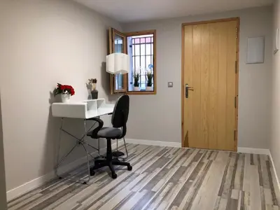 a room with a desk and a chair and a door at Villa Bruno&Playa de Valencia in Valencia