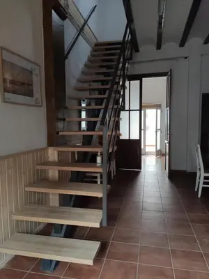 a staircase in a room with a tiled floor at CASA BAUTISTA - ROTGLÀ in Rotglá y Corbera