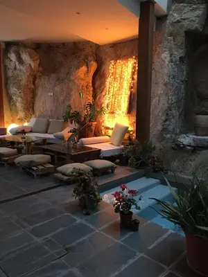 a living room with couches and a table with a laptop at CASA PORTALICO in Jérica
