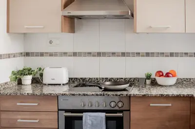 a kitchen with a sink and a counter top at Apartamentos FV Flats Valencia - Mestalla 7 in Valencia