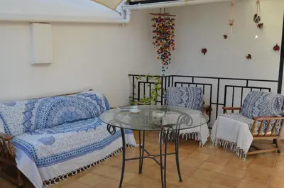 a living room with a couch and a glass table at Casa el Castell in Eslida