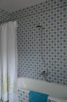 a bathroom with a bath tub and a shower curtain at Casa el Castell in Eslida