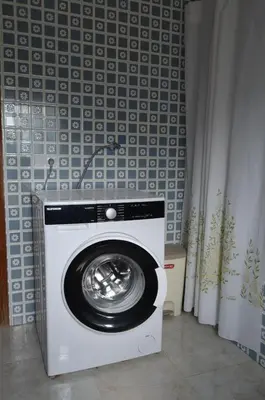 a washing machine in a room with a wall at Casa el Castell in Eslida