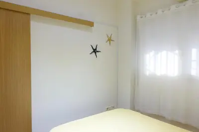 a dressing room with a mirror and a closet at Best Valencia Beach Rooms-Shared Flat in Valencia