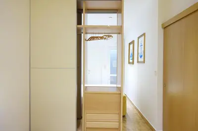 a bedroom with a bed and two pictures on the wall at Best Valencia Beach Rooms-Shared Flat in Valencia