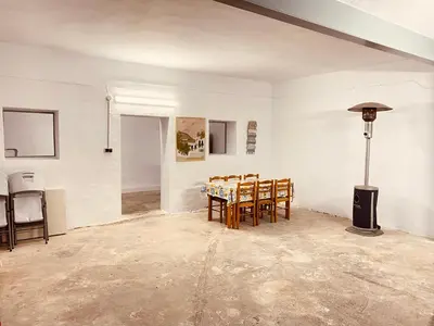a dining room with a table and chairs at Casa Mayor in Tous