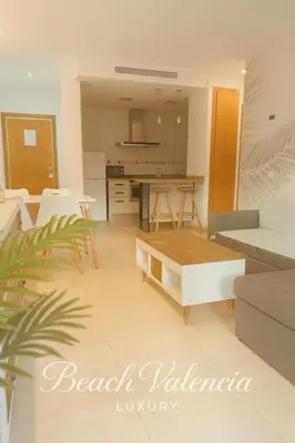 a living room with a couch and a table at BEACH VALENCIA LUXURY A40-13 Apartment with terrace and sea views in Valencia