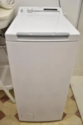 a white refrigerator with a laptop on top of it at Gran apartamento cerca de Ruzafa in Valencia
