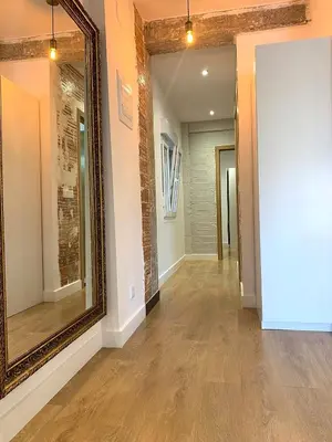 a hallway with a large mirror and a hallway with a hallway at Puerto Playa Paradise in Puerto de Sagunto