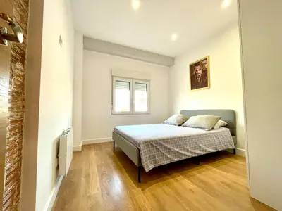 a bedroom with a bed and a window at Puerto Playa Paradise in Puerto de Sagunto