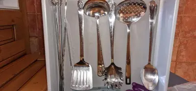 a group of silver spoons in a drawer at Casa Azahara your Valencian Villa in Macastre
