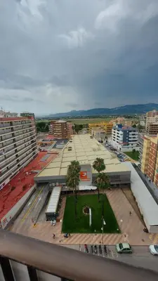 an aerial view of a city with a large building at Apartamento SUERTE con vistas a la playa San Antonio de Cullera in Cullera