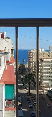 a view of a city street from a window at Apartamento SUERTE con vistas a la playa San Antonio de Cullera in Cullera