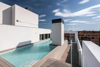 a swimming pool on the roof of a building at Apartamentos Core Suites Valencia in Valencia