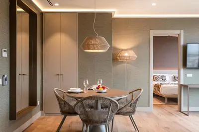 a dining room with a table and chairs at Apartamentos Core Suites Valencia in Valencia