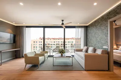 a living room with a couch and a table at Apartamentos Core Suites Valencia in Valencia