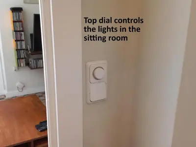 a door with a sign that says top dial controls the lights in the sitting room at Classic City Apartment in Valencia