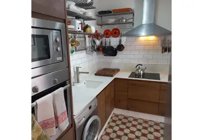 a small kitchen with a sink and a stove at Classic City Apartment in Valencia