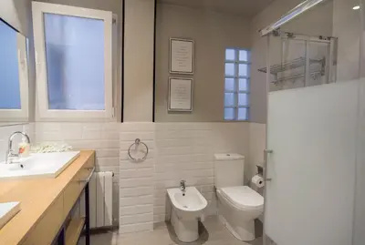 a bathroom with a toilet and a sink at City Hall Central Market in Valencia