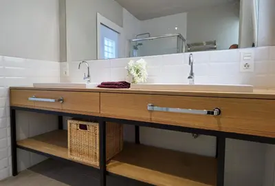 a bathroom with two sinks and a mirror at City Hall Central Market in Valencia