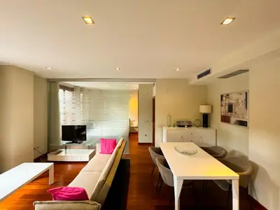 a living room with a couch and a table at Precioso Apartamento en la Plaza del Tossal in Valencia