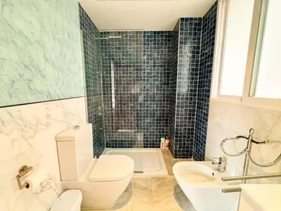a bathroom with a toilet and a sink and a shower at Precioso Apartamento en la Plaza del Tossal in Valencia