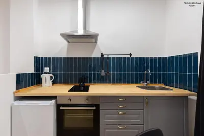 a kitchen with a sink and a counter top at Hotelito Boutique Valencia Estación in Valencia