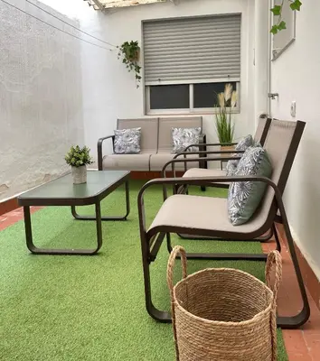 a living room with two chairs and a table at UIM Mediterraneo Juana Wifi in Puerto de Sagunto