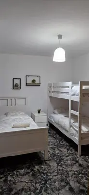 a bedroom with two bunk beds and a lamp at UIM Mediterraneo Juana Wifi in Puerto de Sagunto