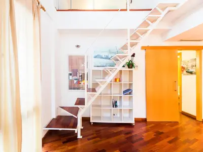 a white staircase in a room with wooden floors at Total Valencia (Leisure & Culture) in Valencia