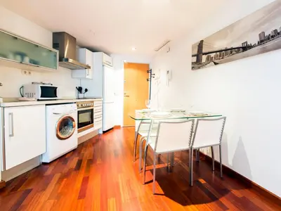 a kitchen with a table and chairs in it at Total Valencia (Leisure & Culture) in Valencia