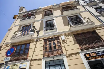 a tall building with windows and balconies on it at Singular Apartments Station in Valencia