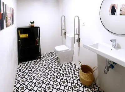 a bathroom with a toilet and a sink and a mirror at Residencia Demar in Godella