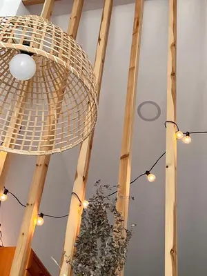 a wicker chandelier is hanging from a ceiling at Alojamiento en Losa del Obispo in Losa del Obispo