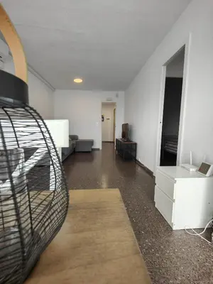 an empty room with a living room with a room at Precioso apartamento residencial con vistas al mar in Puebla de Farnals