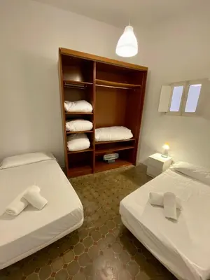 a bedroom with a bed with two towels on it at Ruzafa Vibes Apartments in Valencia