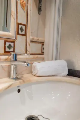 a bathroom with a white tub and a mirror and a towel at Platja Puig in Valencia