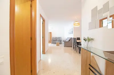 a living room with a couch and a coffee table at Global Vacacional, Increíble apartamento en la playa, Canet d'en Berenguer in Canet de Berenguer