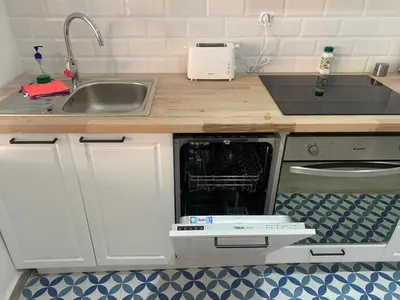a small kitchen with a sink and a dishwasher at Alzira bonita Loft A junto plaza mayor, la Murta in Alzira