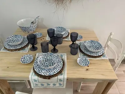 a wooden table with blue and white plates and spoons at Alzira bonita Loft A junto plaza mayor, la Murta in Alzira