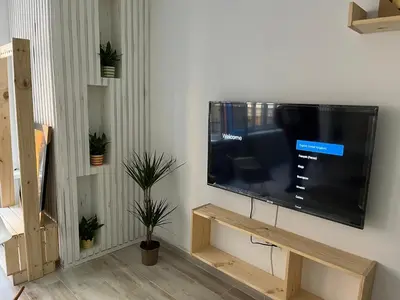 a flat screen tv hanging on a wall at Alzira bonita Loft A junto plaza mayor, la Murta in Alzira