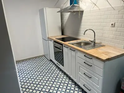 a small kitchen with a sink and a counter at Alzira bonita Apartamento B con patio, la Casella in Alzira