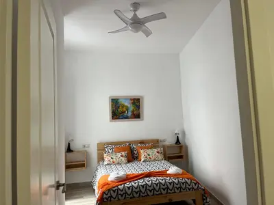 a bedroom with a bed and a ceiling fan at Alzira bonita Apartamento B con patio, la Casella in Alzira