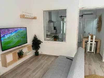 a living room with a flat screen tv on a wall at Alzira bonita Loft C junto plaza mayor, Les Muralles in Alzira