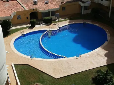 an overhead view of a large blue swimming pool at Les Motes Solo Familias Serviplaya!!! in Playa de Xeraco