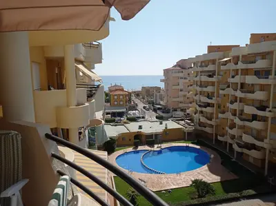 a view from the balcony of a building with a swimming pool at Les Motes Solo Familias Serviplaya!!! in Playa de Xeraco