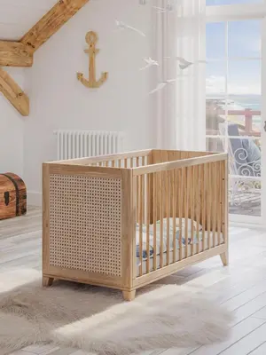 a wooden crib in a room with a window at Alzira bonita Ático E Plaza Mayor con gran terraza in Alzira