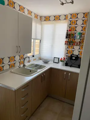 a kitchen with a sink and a window at Pobla-Mar in Valencia